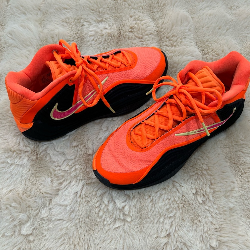 Nike Orange and Black Low-Top Sneakers with Pink Swoosh